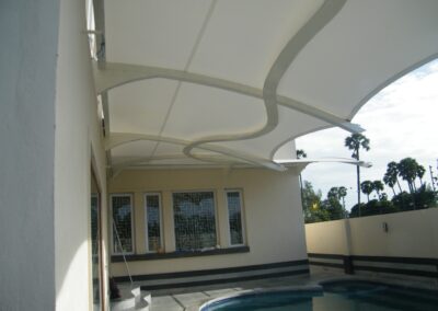 Commercial tensile structures for outdoor seating and event spaces.