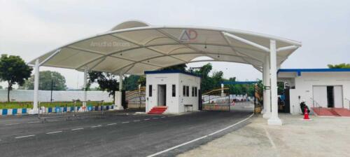 An outdoor venue featuring expansive tensile roofing that allows natural light to filter through.